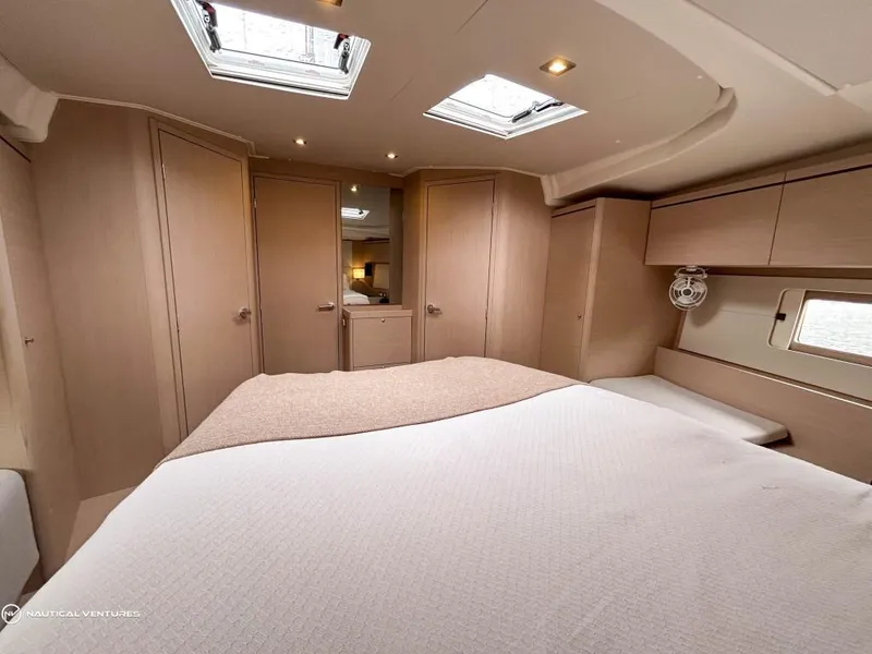 Slide: The Image of Luxurious cabin interior of 2024 Beneteau Oceanis 51.1 yacht with skylights and modern design. - 28