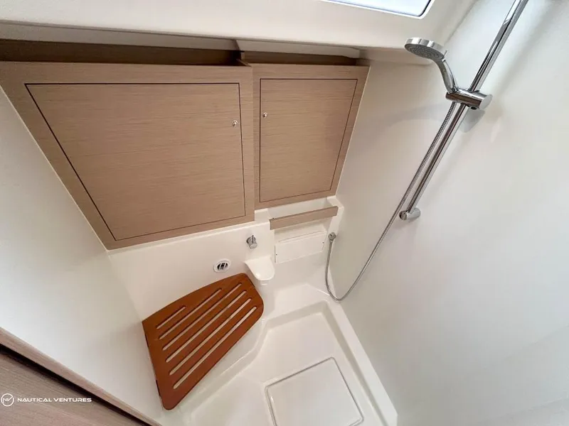 Slide: The Image of 2024 Beneteau Oceanis 51.1 yacht bathroom with wooden seat and modern shower. - 33