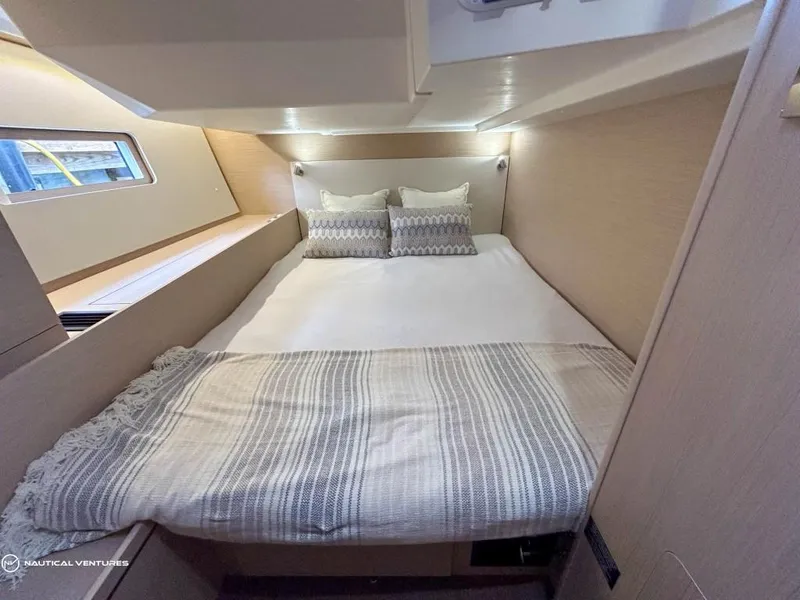Slide: The Image of Luxurious cabin interior of 2024 Beneteau Oceanis 51.1 yacht with cozy bedding. - 34