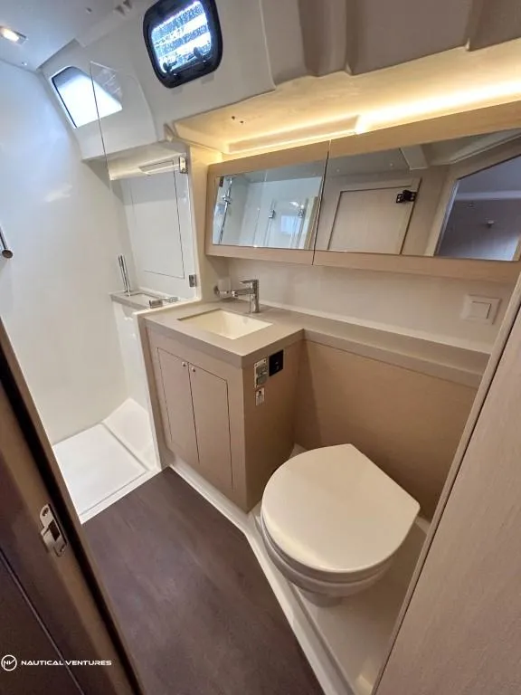 Slide: The Image of Modern bathroom in 2024 Beneteau Oceanis 51.1 yacht with sleek fixtures and ample lighting. - 36