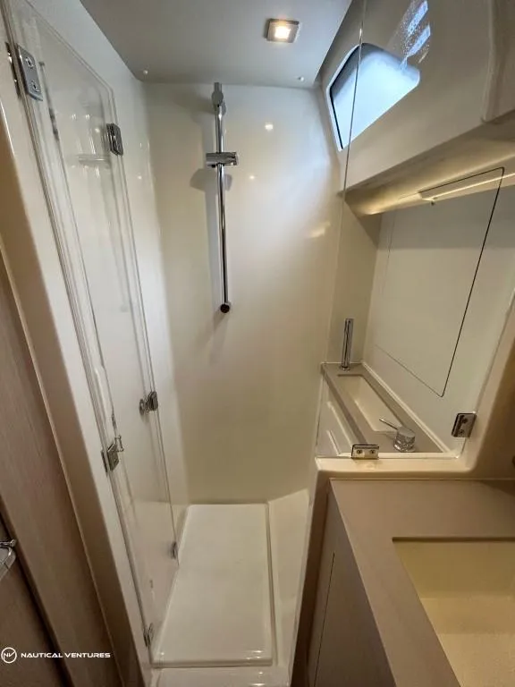 Slide: The Image of 2024 Beneteau Oceanis 51.1 yacht bathroom with modern shower and sleek design. - 38