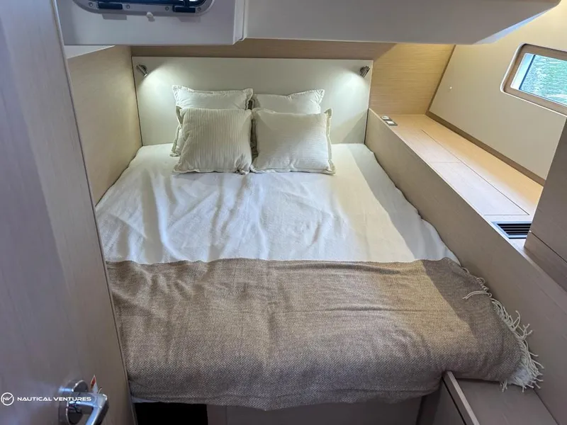 Slide: The Image of Luxurious cabin interior of 2024 Beneteau Oceanis 51.1 yacht with cozy bedding. - 40