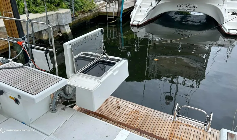 Slide: The Image of Beneteau Oceanis 51.1 yacht docked, showcasing open storage compartment, 2024 model. - 6