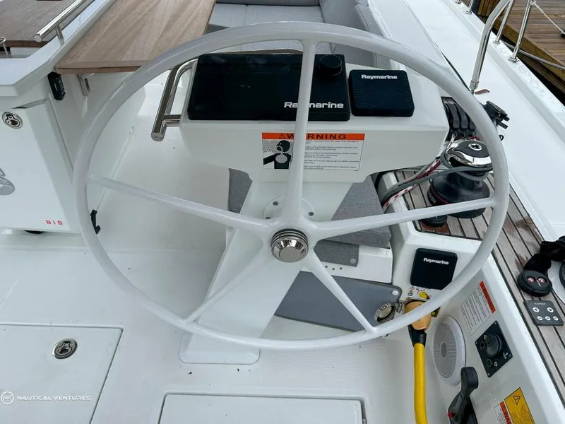 Slide: The Image of Steering wheel of 2024 Beneteau Oceanis 51.1 yacht with Raymarine equipment. - 14