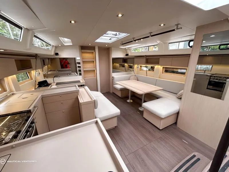 Slide: The Image of Luxurious interior of 2024 Beneteau Oceanis 51.1 yacht with modern kitchen and seating area. - 19