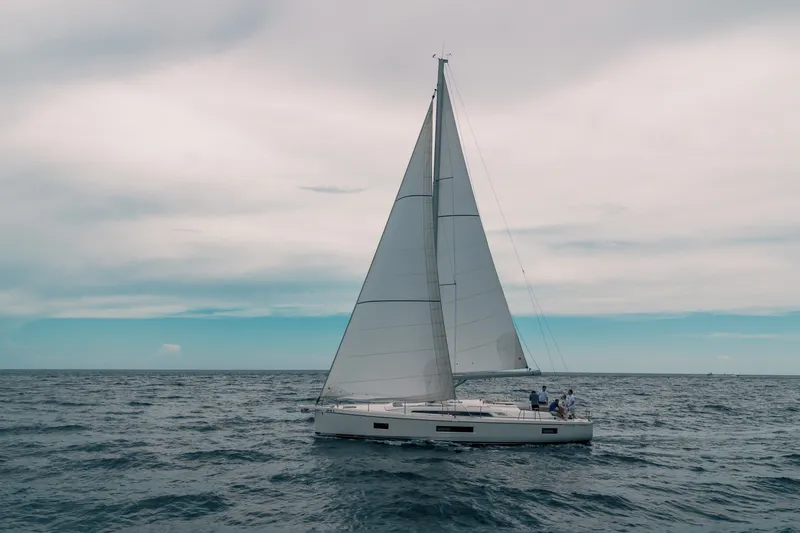 Slide: The Image of 2024 Beneteau Oceanis 51.1 sailing on open sea under cloudy sky. - 46