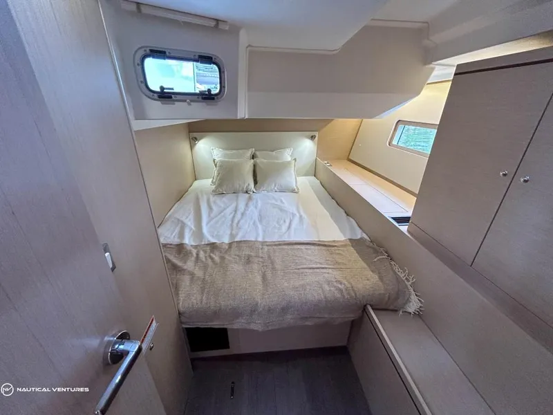 Slide: The Image of Luxurious cabin interior of 2024 Beneteau Oceanis 51.1 yacht with cozy bedding. - 39
