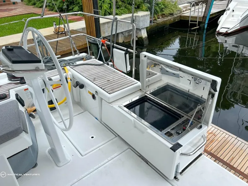 Slide: The Image of 2024 Beneteau Oceanis 51.1 yacht deck with open storage compartment. - 10