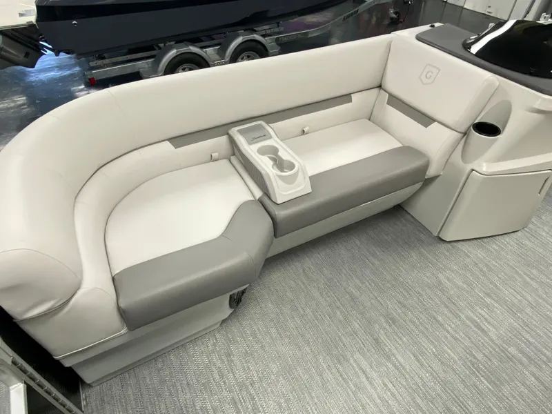 Slide: The Image of 2023 Godfrey Sweetwater 2286 SBX boat interior with gray and white seating. - 10
