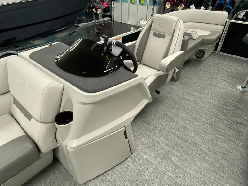Slide: The Image of 2023 Godfrey Sweetwater 2286 SBX boat interior with helm and seating. - 11