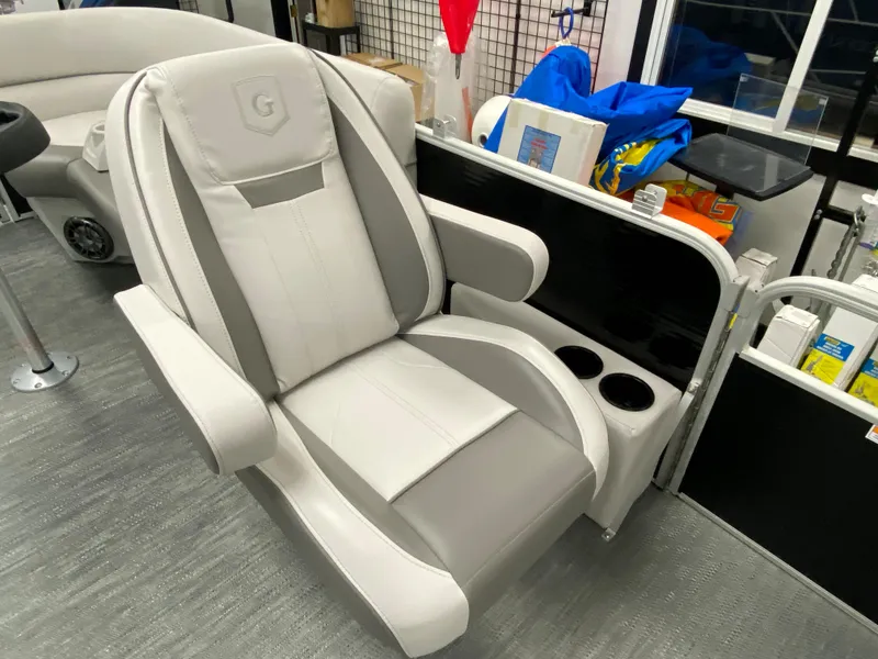 Slide: The Image of 2023 Godfrey Sweetwater 2286 SBX boat seat, gray and white, with cup holders. - 14