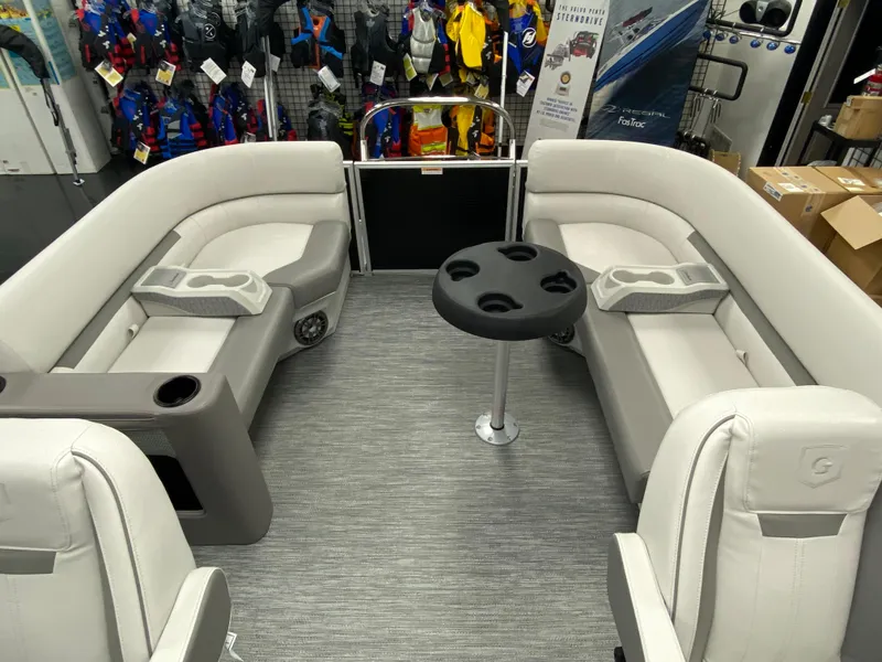 Slide: The Image of 2023 Godfrey Sweetwater 2286 SBX pontoon boat interior with plush seating and cup holders. - 15