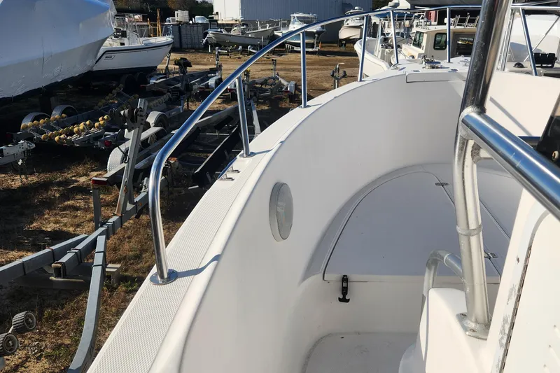 Slide: The Image of 2001 Cobia 274 Center Console boat on trailer, side view. - 16