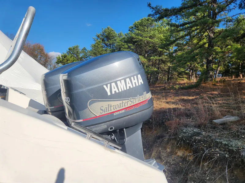 Slide: The Image of Yamaha outboard motor on 2001 Cobia 274 Center Console boat, outdoors. - 5
