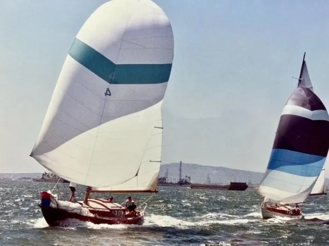 Slide: The Image of Sailboats racing on the ocean, featuring a 1961 Lapworth 40 model. - 12