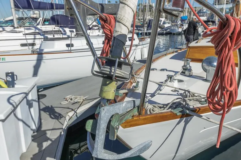 Slide: The Image of Sailboat Lapworth 40, 1961 model, docked with anchor and ropes visible. - 13