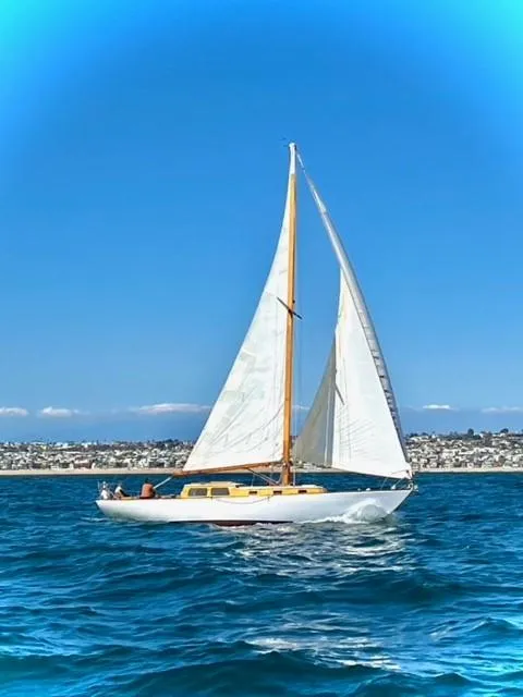 Slide: The Image of Sailboat Lapworth 40, 1961 model, cruising on blue ocean under clear sky. - 15