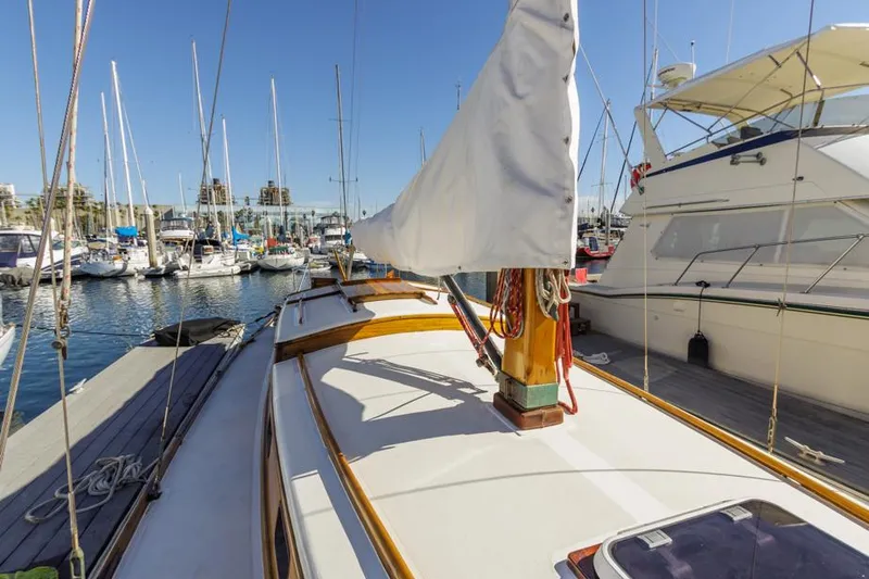 Slide: The Image of Sailboat docked in marina, Lapworth 40 model, 1961, with clear blue sky. - 24