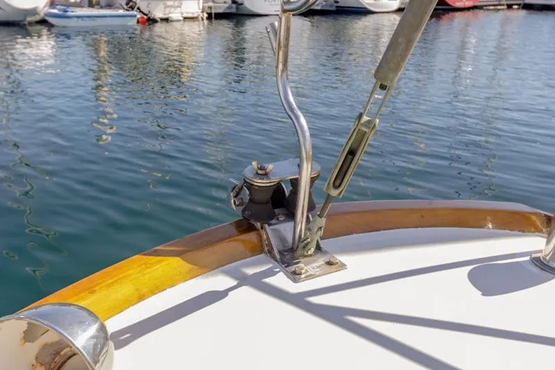 Slide: The Image of Deck detail of a 1961 Lapworth 40 sailboat, showing rigging and water reflections. - 36