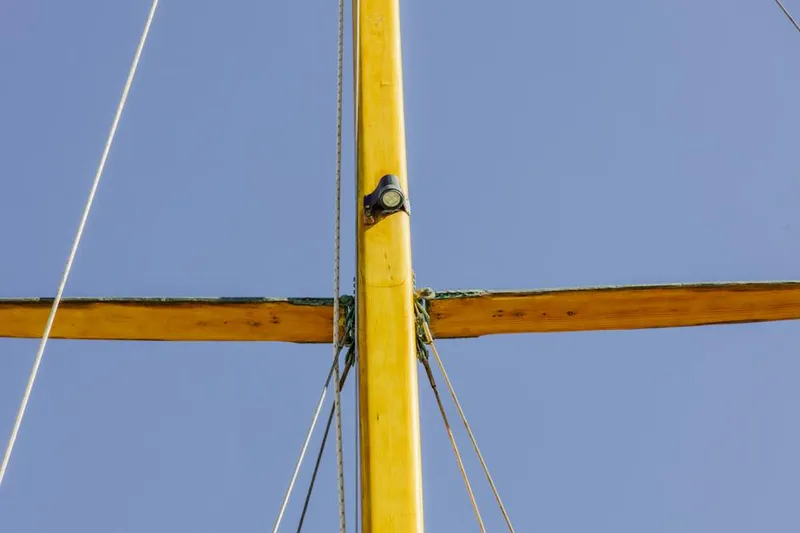 Slide: The Image of Mast of 1961 Lapworth 40 sailboat against clear blue sky. - 42