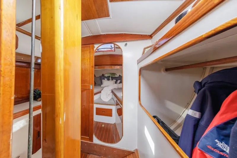 Slide: The Image of Interior of a 1961 Lapworth 40 sailboat, featuring wooden finishes and cozy cabin space. - 48
