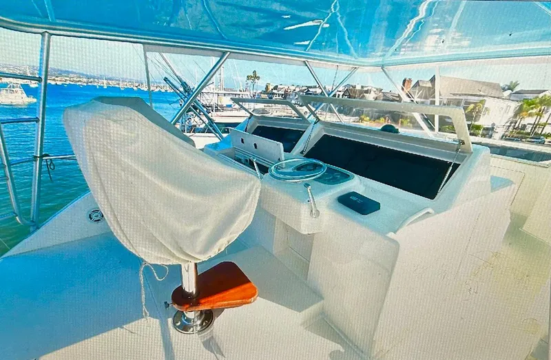 Slide: The Image of Viking 65 Convertible 2000 yacht helm with ocean view and covered captain's chair. - 10