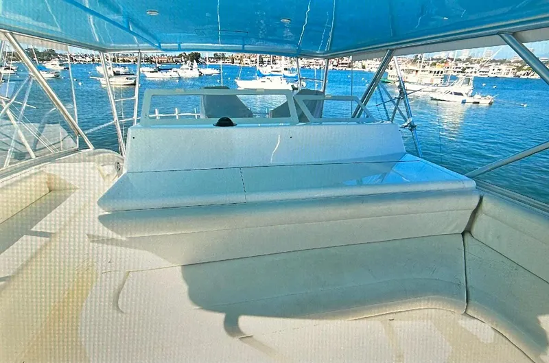 Slide: The Image of Viking 65 Convertible yacht interior, 2000 model, overlooking marina with boats. - 14