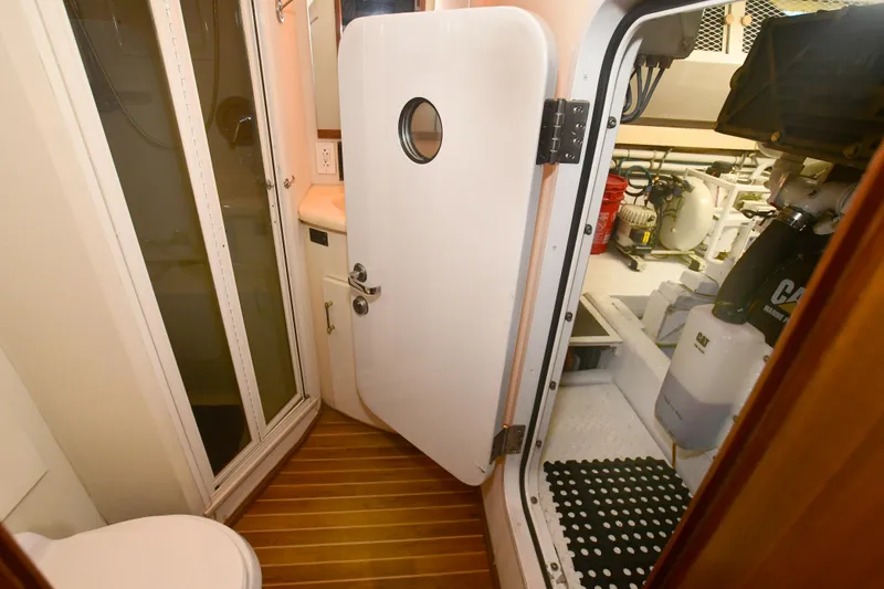 Slide: The Image of Engine room access door on a 2000 Viking 65 Convertible yacht. - 19