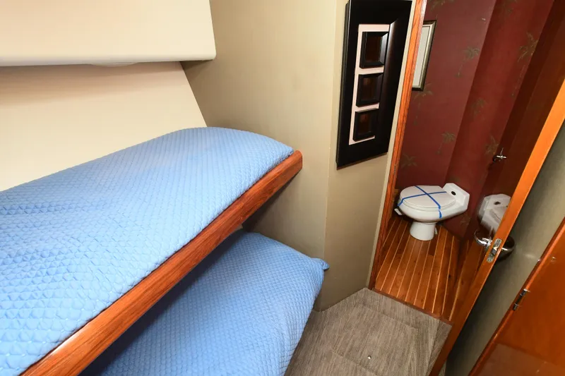 Slide: The Image of Bunk beds and bathroom in 2000 Viking 65 Convertible yacht. - 27
