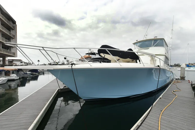 Slide: The Image of Viking 65 Convertible 2000 yacht docked at marina, front view. - 9