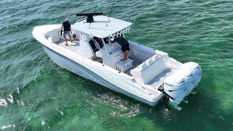 Slide: The Image of 2003 Deep Impact 36 Open boat cruising on clear green waters. - 0