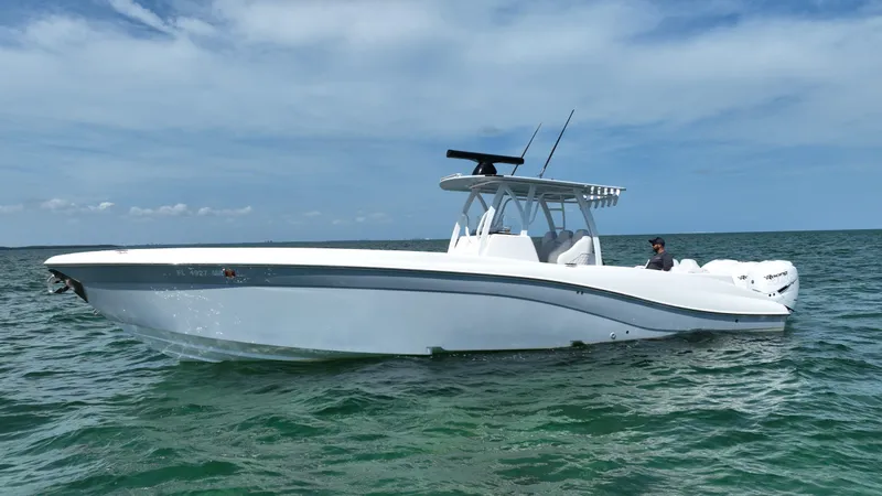 Slide: The Image of 2003 Deep Impact 36 Open boat on the water under a clear sky. - 1