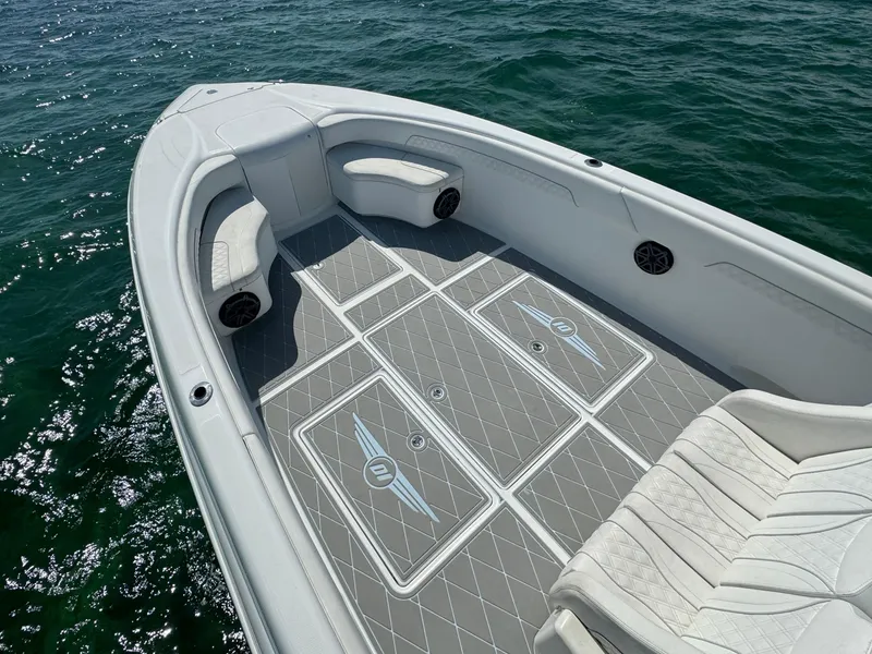 Slide: The Image of 2003 Deep Impact 36 Open boat interior with gray deck and seating. - 10