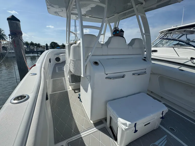 Slide: The Image of 2003 Deep Impact 36 Open boat interior with seating and cooler. - 11