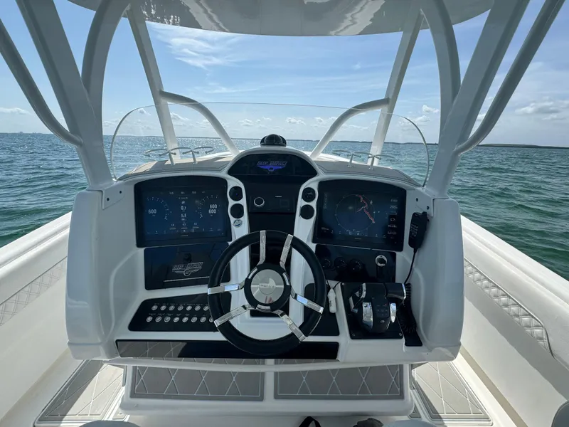 Slide: The Image of Helm of 2003 Deep Impact 36 Open boat with ocean view. - 13