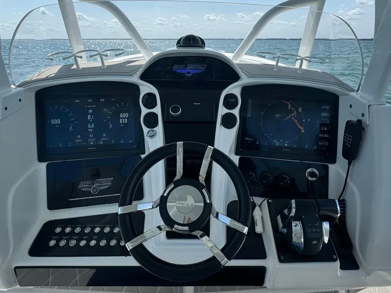 Slide: The Image of Cockpit of a 2003 Deep Impact 36 Open boat with modern navigation instruments. - 14