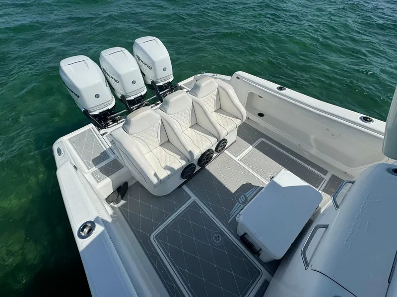 Slide: The Image of 2003 Deep Impact 36 Open boat with triple outboard engines and spacious seating. - 20