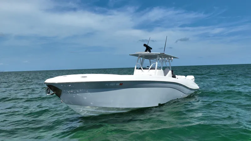 Slide: The Image of 2003 Deep Impact 36 Open boat on the ocean under a clear blue sky. - 3