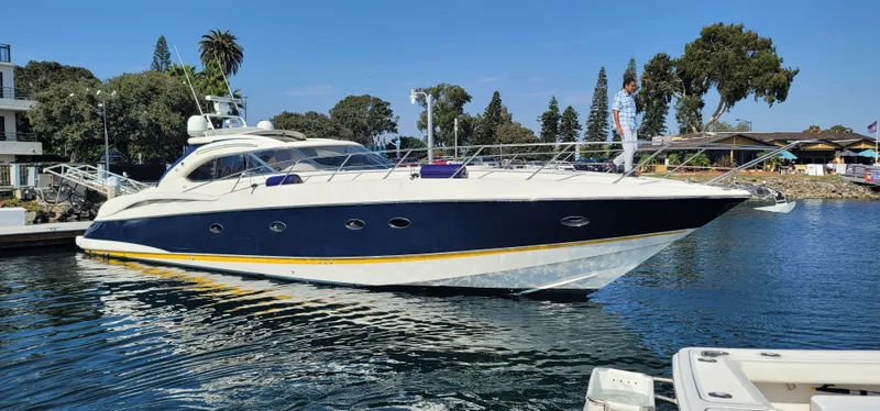 Slide: The Image of 2000 Sunseeker Predator 58 yacht docked in harbor. - 14