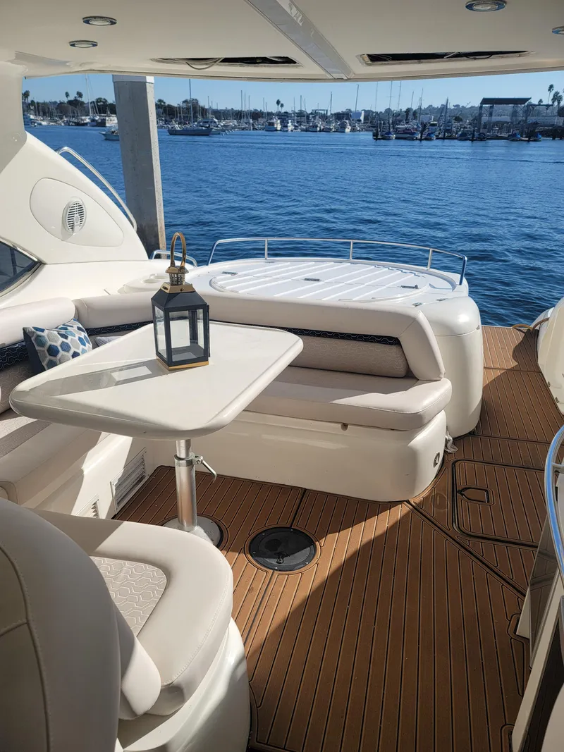 Slide: The Image of Luxurious Sunseeker Predator 58 yacht deck with harbor view. - 18