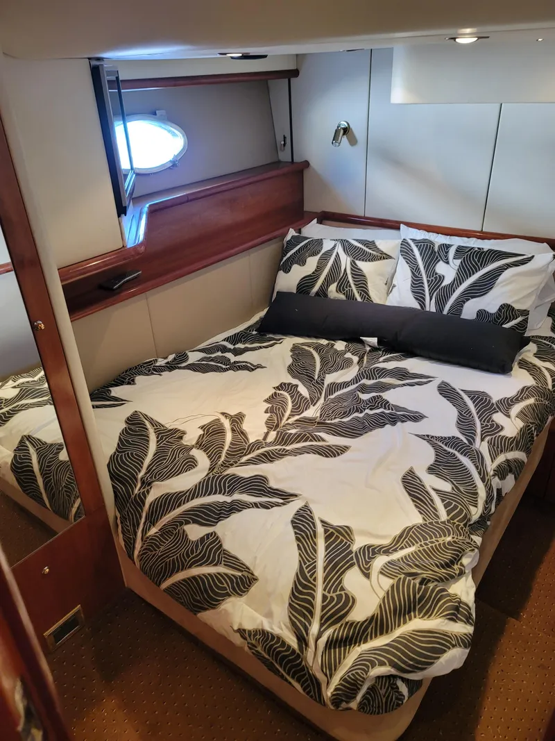 Slide: The Image of Sunseeker Predator 58 yacht interior, bedroom with bed. - 27