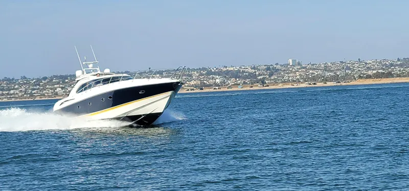 Slide: The Image of 2000 Sunseeker Predator 58 yacht cruising on open water. - 5