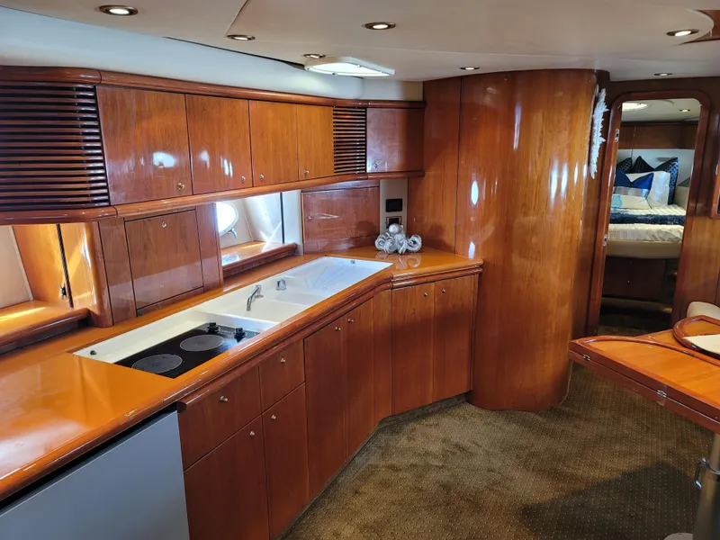 Slide: The Image of Interior of 2000 Sunseeker Predator 58 yacht with elegant wood finish. - 21
