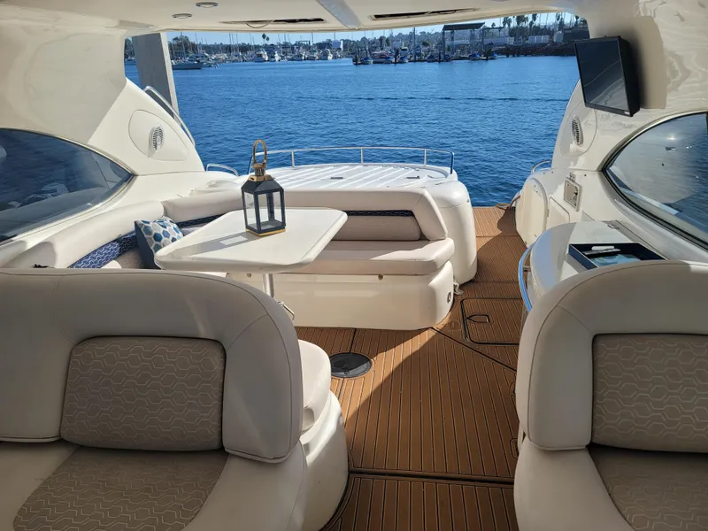 Slide: The Image of Interior of a 2000 Sunseeker Predator 58 yacht overlooking the water. - 15