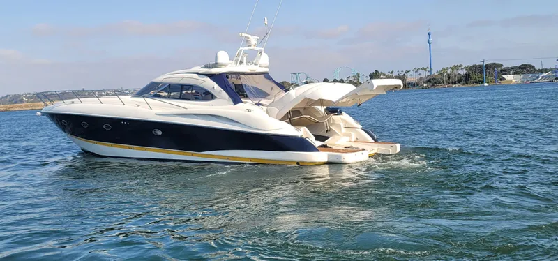 Slide: The Image of 2000 Sunseeker Predator 58 yacht cruising on water. - 8