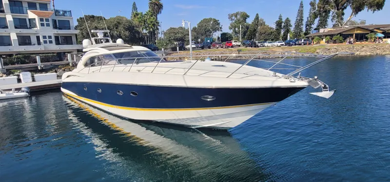 Slide: The Image of 2000 Sunseeker Predator 58 yacht docked in harbor. - 11