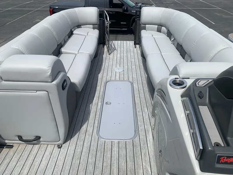 Slide: The Image of 2023 Ranger 2500LS pontoon boat interior with gray seating and deck. - 5