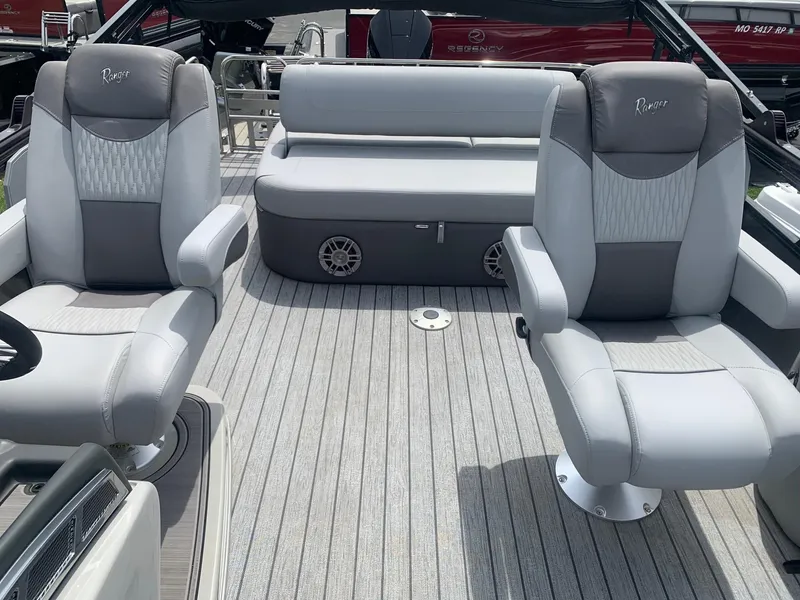 Slide: The Image of 2023 Ranger 2500LS boat interior with gray seating and modern design. - 6