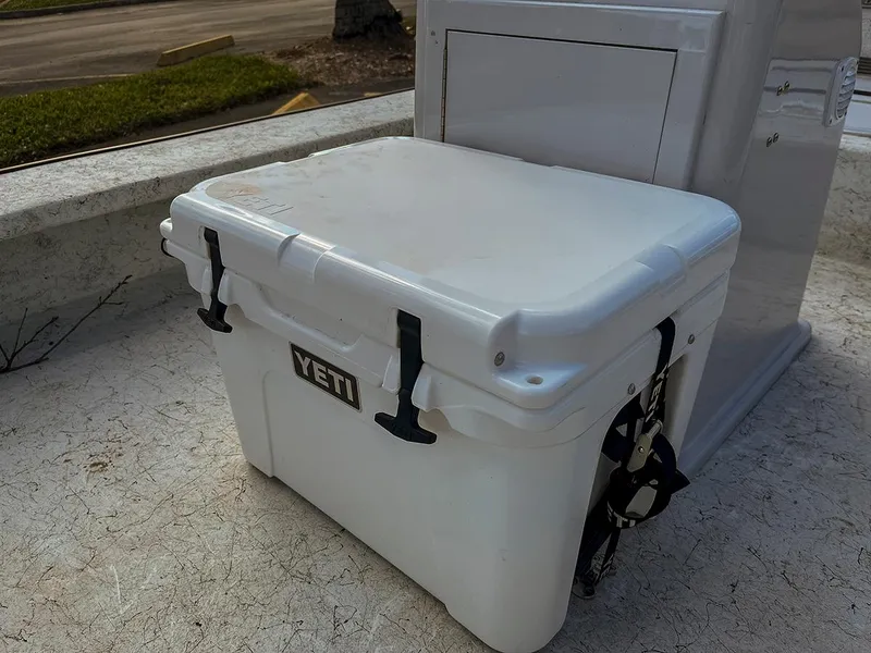 Slide: The Image of White Yeti cooler on 2022 Bossman 17 Flats Boat deck. - 11