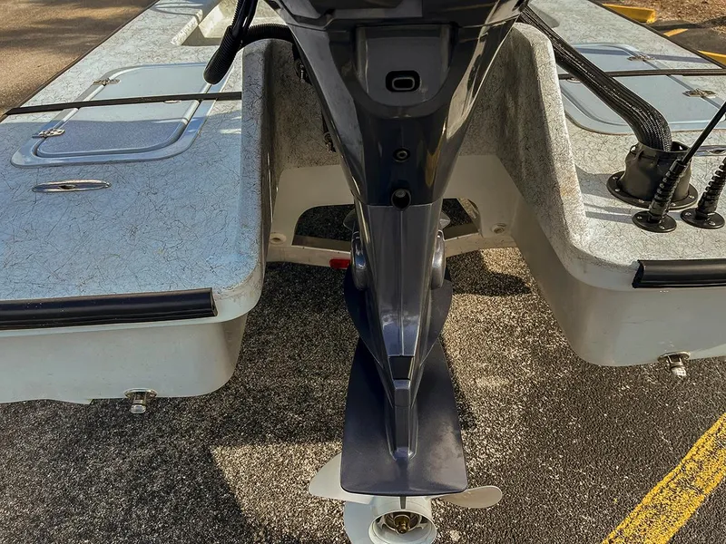 Slide: The Image of 2022 Bossman 17 Flats Boat, rear view showing motor and deck details. - 3